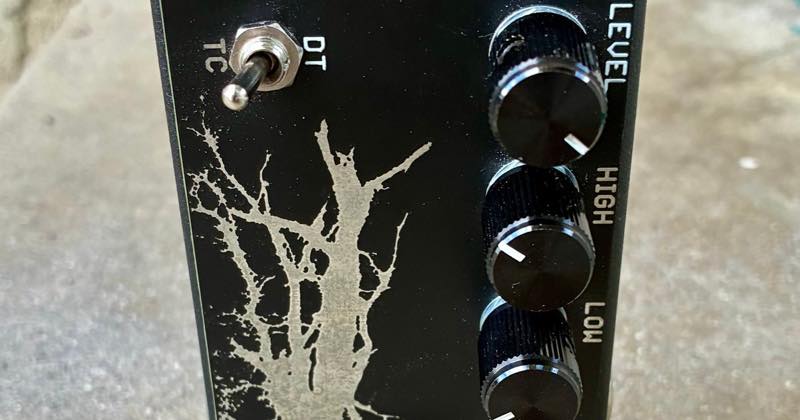 Close-up of the Dirty Tree's controls: the TC/DT toggle, the etched tree and the level, high and low knobs